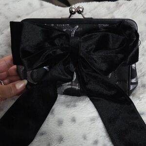 Elegant Black  Coach Clutch with Bow Accent